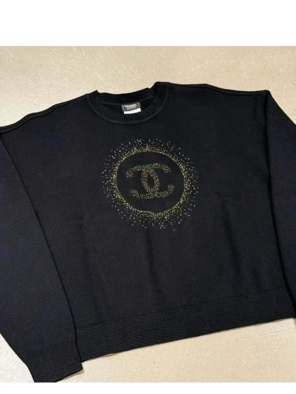 CHANEL Uniform Black Crewneck Sweater with Gold CC Sunburst